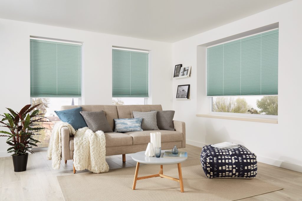 three green pleated blinds