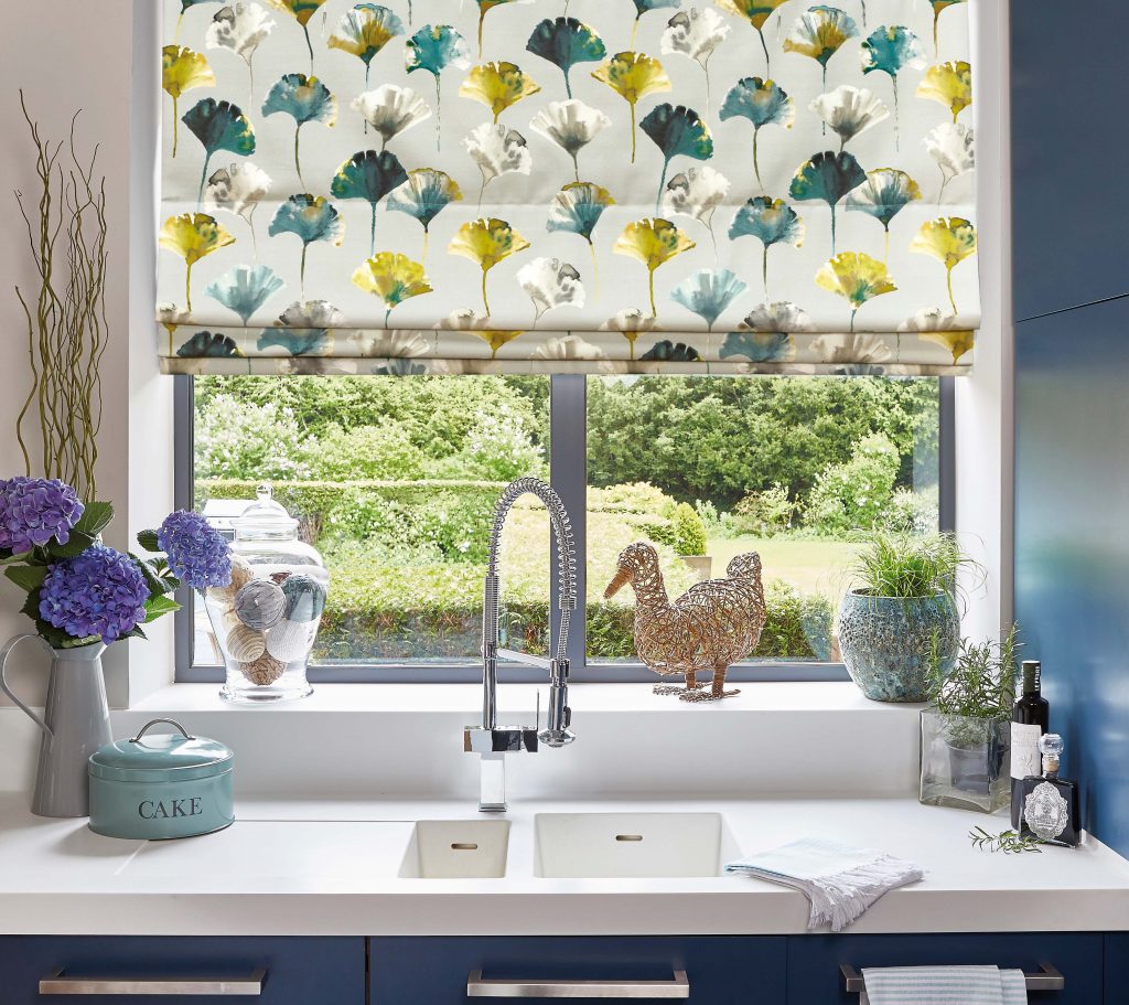 patterned roman blinds above sink