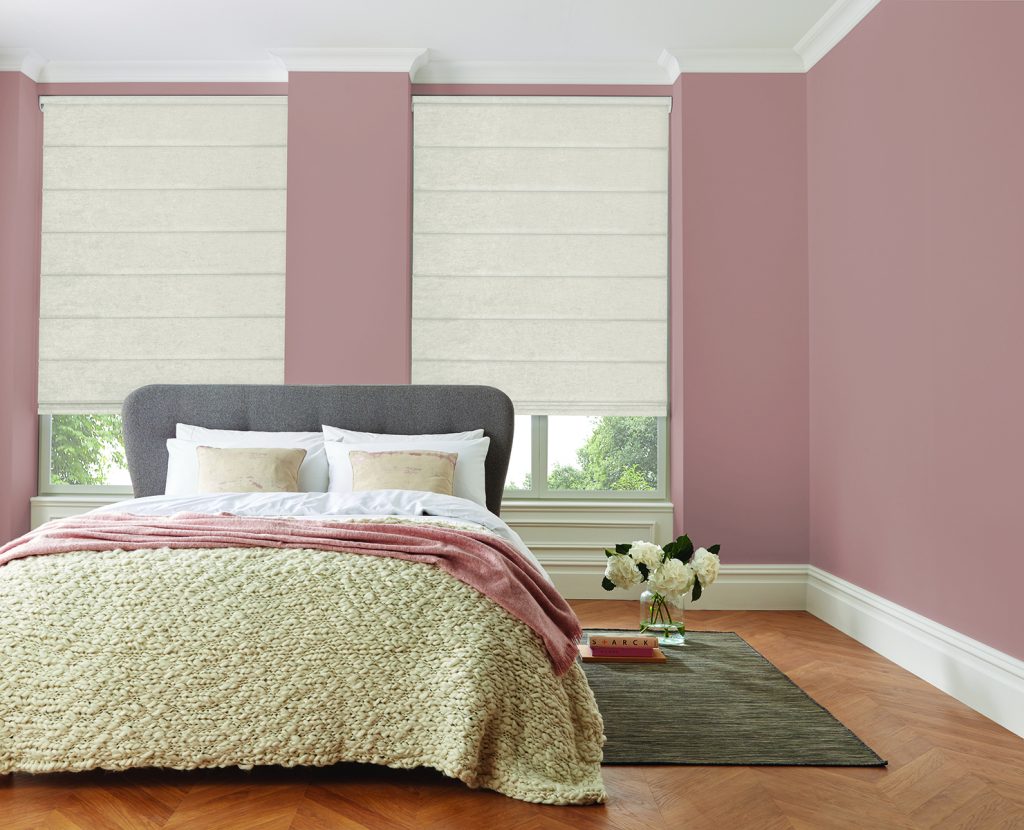 roman blinds in bedroom with pink walls